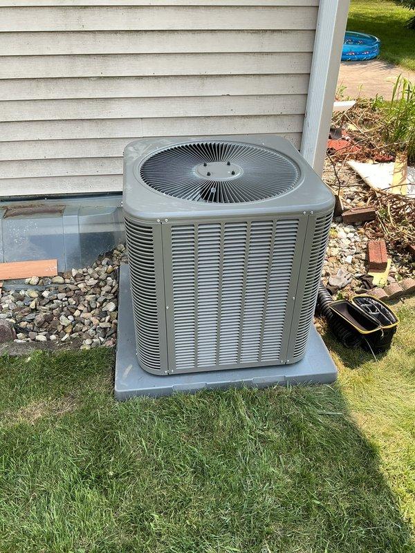 Completed full A/C system installation including ML13KC1-030 outdoor condenser unit and CK40CT-30B indoor coil. Vacuumed and thoroughly cleaned blower cabinet and blower wheel to ensure optimal airflow. Adjusted blower speed settings to accommodate upgraded 2.5 ton air conditioning capacity, replacing existing 2 ton system. Installed thermostat utilizing existing T4/T6 stats. All electrical connections, refrigerant lines, and condensate drainage properly installed and secured. System tested and verified operational. Equipment models and serial numbers documented in service records.