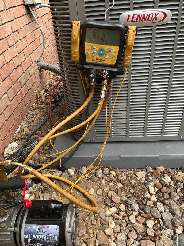 Completed installation of new Lennox ML13KC1-048 air conditioning system with matching CK40CT-49C evaporator coil. Removed existing evaporator coil from plenum to access and inspect the 20-year-old furnace heat exchanger for cracks and structural integrity. Temporarily removed and reinstalled humidifier to facilitate coil access during installation. Extracted coil from cabinet housing and slid into existing plenum, preserving original coil cabinet for future use. Reused existing thermostat to maintain customer's preferred control interface. Installed refrigerant lines connecting outdoor condensing unit to indoor evaporator coil, performed vacuum and pressure testing, and charged system to manufacturer specifications. Verified proper airflow, temperature differential, and system operation upon startup. All connections secured and system left in full operational condition.