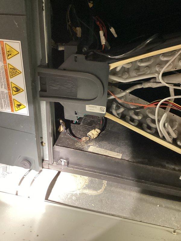 Responded to no cooling call and performed system diagnostics. Inspected air handler unit in attic space, examining ductwork installation, insulation integrity, and internal components including heat exchanger and electrical connections. Documented existing conditions with photos showing flexible duct runs through attic insulation and interior cabinet components with visible wiring harnesses and warning labels.