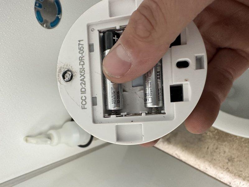 Responded to service callback for two automatic flush sensors that were detaching from toilet fixtures. Upon inspection, found that adhesive mounting method was failing due to textured wall surfaces preventing proper adhesion. Removed existing sensors, assessed mounting locations, and reinstalled units using alternative mechanical fastening method suitable for textured surfaces to ensure secure, permanent attachment and proper sensor operation.
