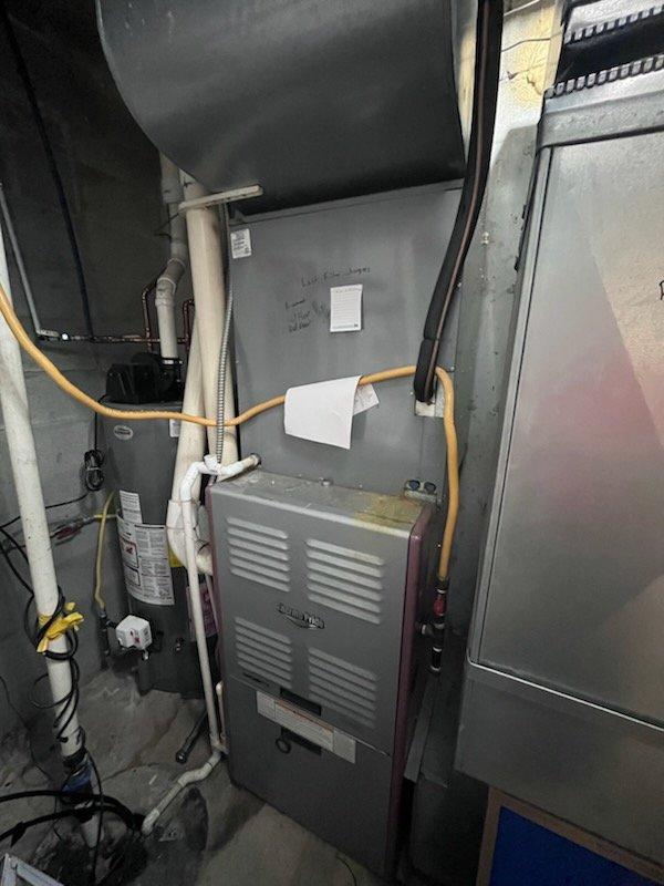 Responded to urgent commercial HVAC replacement quote request for 5-ton split system with failed compressor due to grounded winding. Conducted on-site assessment and photographic documentation of existing equipment including furnace, evaporator coil, condensing unit, gas lines, and ductwork configuration in mechanical room. Prepared comprehensive replacement estimate with two options: partial replacement of condenser and evaporator coil while retaining existing furnace, and complete system replacement including all components.