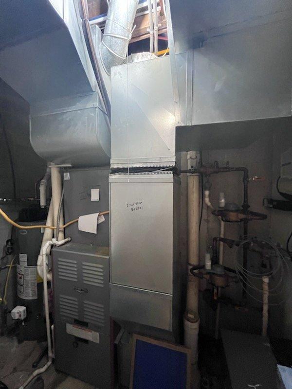 Responded to urgent commercial HVAC replacement quote request for 5-ton split system with failed compressor due to grounded winding. Conducted on-site assessment and photographic documentation of existing equipment including furnace, evaporator coil, condensing unit, gas lines, and ductwork configuration in mechanical room. Prepared comprehensive replacement estimate with two options: partial replacement of condenser and evaporator coil while retaining existing furnace, and complete system replacement including all components.