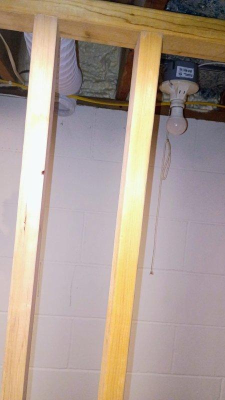 Provided plumbing estimate for installation of new backup sump pump system in unfinished basement area. Assessed site conditions including existing rough-in requirements for drainage piping, evaluated wooden framed utility space with exposed joists and concrete flooring, and documented installation location for backup pump configuration to supplement primary system.