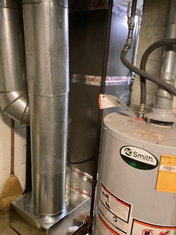 Completed full HVAC system installation including ML196UH045 furnace, ML13KC1-024 condensing unit, and CK40CT-30B evaporator coil. Installed new line set, ran PVC venting for condensate drainage, and mounted outdoor condenser unit on concrete pad adjacent to residence. Configured T-stat for system operation, verified all connections, and tested system functionality. Installation was rescheduled due to road access restrictions but completed successfully once access was restored.