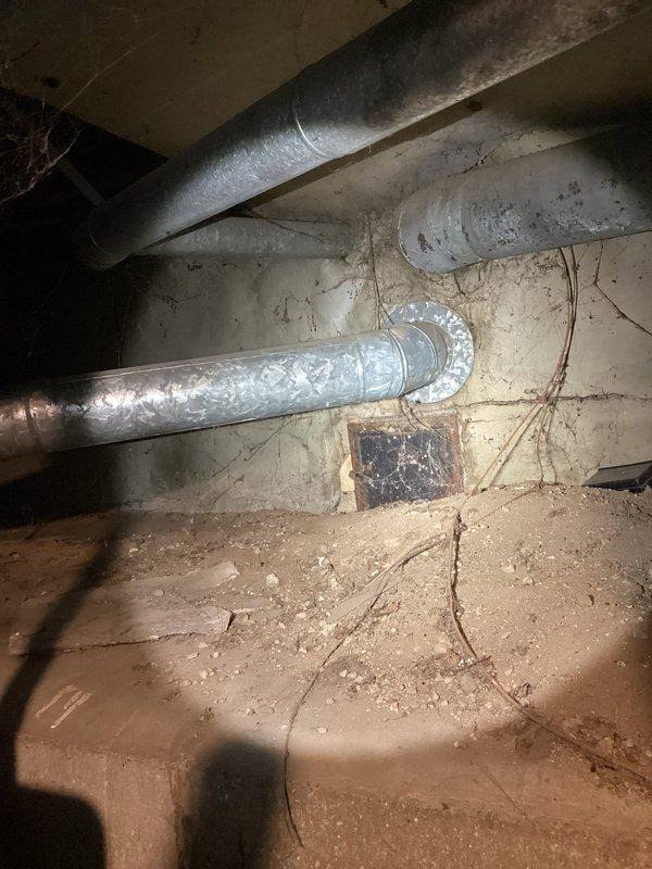 Responded to service call for 8-year-old gas water heater with reported venting issues that had been shut off by customer as a safety precaution. Upon arrival, performed comprehensive inspection of water heater and venting system. Examined the unit's combustion chamber, burner assembly, and flue connections for proper operation and code compliance.

Conducted thorough assessment of the venting configuration, including horizontal and vertical vent piping runs. Identified significant condensation accumulation on metal ductwork in basement area, indicating potential draft issues or improper venting conditions. Inspected vent termination point and checked for blockages, debris, or structural concerns that could impair proper exhaust flow.

Evaluated the water heater's draft hood connection and verified clearances from combustible materials. Tested combustion air supply to ensure adequate ventilation for safe operation. Examined all pipe connections, joints, and seals throughout the venting