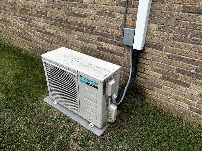 Evaluated existing 5-year-old Daikin 1.5-ton mini split system that was struggling to maintain comfortable temperatures during peak afternoon heat, with indoor temperatures reaching the 80s. Inspected outdoor condenser unit and indoor air handler to assess system performance and capacity limitations. Determined that the existing equipment is undersized for the cooling load requirements of the space. Provided comprehensive estimate for replacement with properly sized mini split system to achieve adequate cooling capacity and improved temperature control during high-demand periods.