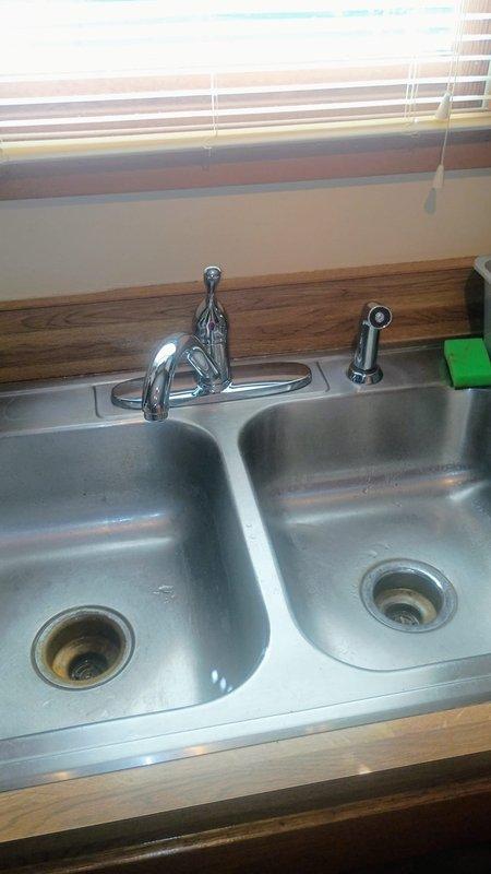 Replaced customer-supplied kitchen faucet and installed new hot water shut off valve under kitchen sink. The existing shut off valve showed signs of age and required replacement to ensure proper water control. Successfully completed installation with all fixtures functioning properly and tested for leaks.