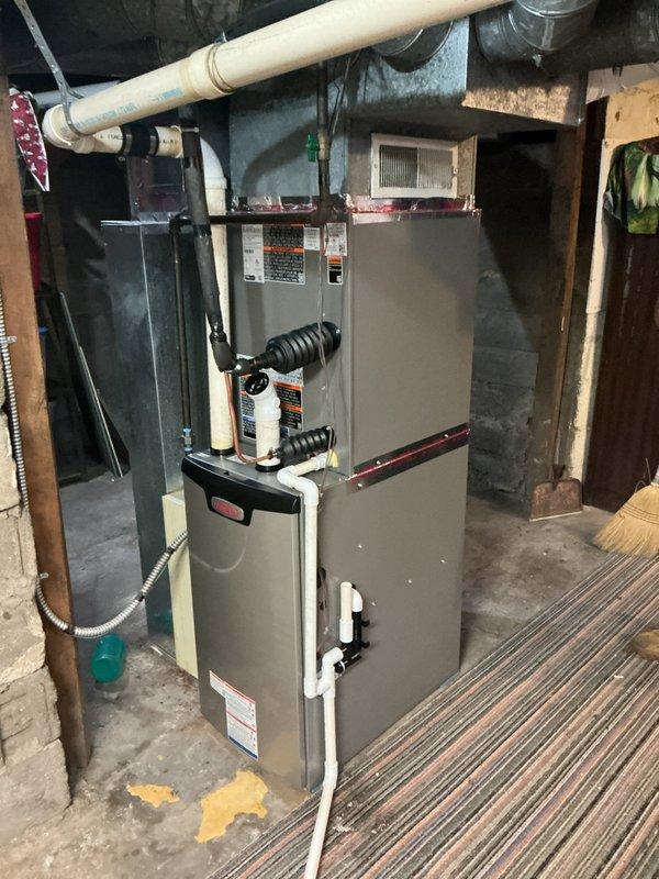 Completed full HVAC system installation including Lennox EL297UH070XV36BK high-efficiency furnace, ML13KC1-030 condensing unit, CK40CT-36B indoor evaporator coil, S200 programmable thermostat, and 16x25x1" return air elbow. System was properly charged with refrigerant using recovery equipment and manifold gauges, all electrical connections verified, condensate drainage installed with PVC piping, and ductwork connections secured. Performed system startup, tested all operational modes, and confirmed proper airflow and temperature differentials across the system.