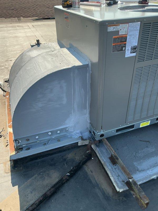 Completed rooftop installation of Lennox package unit with integrated filter rack accommodating two 20x20x1 filters. Fabricated and installed custom supply and return air transitions with internal duct liner for improved thermal performance and noise reduction. Overlaid deteriorated sheet metal cap to restore structural integrity and weather protection. Applied mastic sealant coating to all exposed ductwork to ensure proper air sealing and system efficiency.