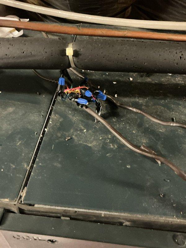 Responded to no cooling call for follow-up repair after pest damage to attic air handler wiring. Previous technician had identified chewed wiring in electrical junction box. Upon arrival, confirmed homeowner had addressed pest issue and unit was ready for rewiring. Accessed attic air handler and inspected damaged electrical connections at junction box and internal unit wiring. Removed compromised wire sections and installed new electrical connections using proper wire nuts and secure terminations. Verified all electrical connections were tight and properly insulated. Restored power to unit and tested system operation. Confirmed air handler energized correctly and cooling cycle initiated properly. System operating within normal parameters with no further electrical issues detected.