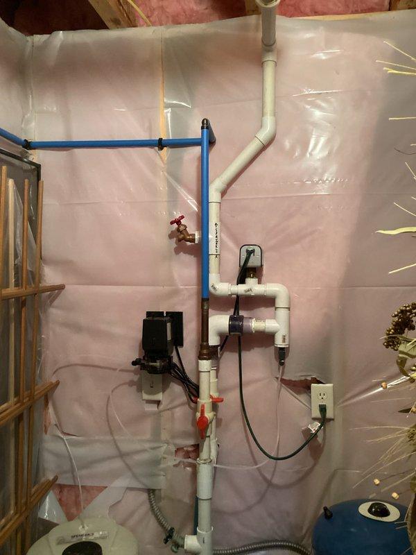 Responded to water leak in basement plumbing system serving sprinkler lines in 19-year-old residence. Located leak in PVC piping assembly and performed repair work on the affected section. Installed protective plastic sheeting over work area to contain moisture and debris during repair process. Repaired compromised PVC pipe connections in the main distribution manifold, which included multiple ball valves and pump assembly. Verified system integrity, tested all connections for proper sealing, and confirmed no additional leaks present throughout the sprinkler supply system.