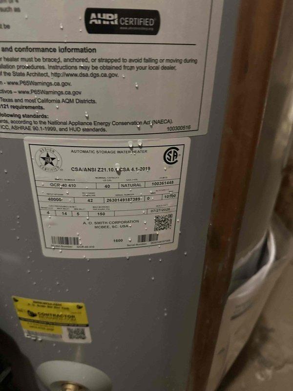 Installed new AO Smith ProLine 40-gallon natural gas water heater (Model GCV 40 410) in basement utility area. Unit was properly positioned, connected to existing gas and water supply lines with copper piping, and vented through metallic ductwork per manufacturer specifications and local building codes.