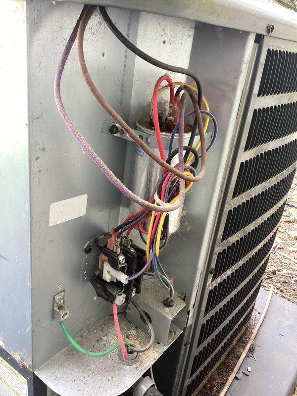 Completed planned maintenance on both air conditioning and heating systems. Performed comprehensive inspection of outdoor unit electrical compartment, noting weathered refrigerant line insulation and minor dirt accumulation typical of outdoor exposure. Observed capacitor terminals with corrosion present at connection points. Replaced 14x20x1 air filter. All system components functioning within normal operating parameters at time of service. Documented equipment condition with photographs for maintenance records.