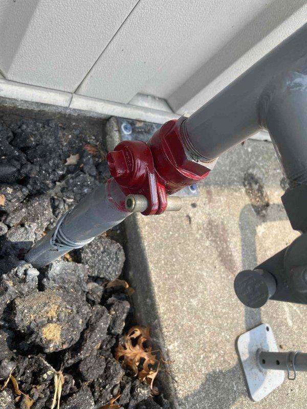 Responded to gas leak investigation following utility company meter replacement. The utility provider had detected a gas leak during new meter installation and disconnected service pending repair. Performed comprehensive leak detection inspection of exterior gas piping system, including meter assembly, vertical pipe runs, and associated fittings mounted on building exterior. Inspected all joints, connections, elbows, and valve assemblies using leak detection equipment. Examined PVC gas line configuration from ground level through rooftop penetration, checking integrity of all pipe sections and fittings. Documented existing piping layout and condition of gas distribution system components for further diagnostic evaluation and repair recommendations.