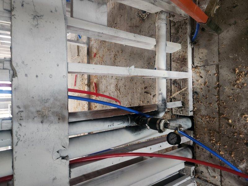 Completed rough-in installation for HVAC system in mechanical room, including mounting heat exchanger unit to concrete block wall with proper bracketing and securing all refrigerant lines. Installed multi-level ductwork through floor joists across multiple stories, routing ventilation piping and coordinating placement with existing structural elements and ensuring proper clearances for ongoing construction work.