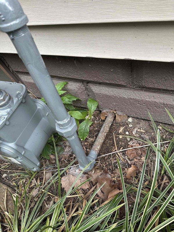 Responded to reported gas leak concern at residential property. Conducted comprehensive inspection of gas piping system including exterior foundation area and basement utility space. Examined gas line penetrations through foundation wall and inspected visible piping runs along ceiling joists and wall-mounted installations. Assessed PVC conduit installations and gray pipe routing at exterior foundation level. Evaluated basement gas distribution system including connections near storage tank area. Inspected pipe supports, joints, and penetration points for signs of compromise or active leakage. Documented conditions with photographic evidence showing pipe installations, foundation penetrations, and basement piping configurations. No active gas leak detected during inspection using standard leak detection procedures. Provided findings and recommendations to property owner regarding system integrity and safety status.