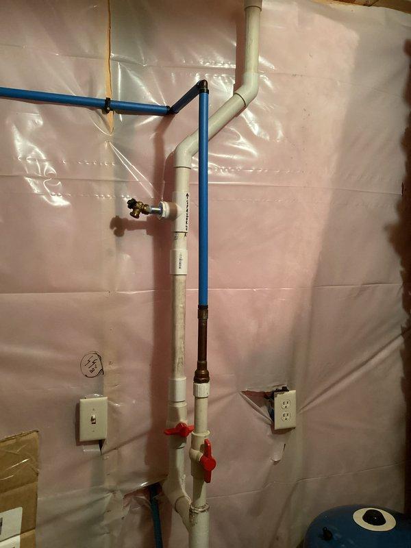 Successfully removed chemical feed pump from irrigation system by cutting 1-1/4" line at fitting below check valve and at 90-degree elbow below boiler drain tee. Spliced in new pipe sections with couplings, allowed PVC cement to cure properly, then pressurized system and verified leak-free operation. Removed pump system from premises per customer instruction. All plumbing connections tested and confirmed operational with no leaks detected.