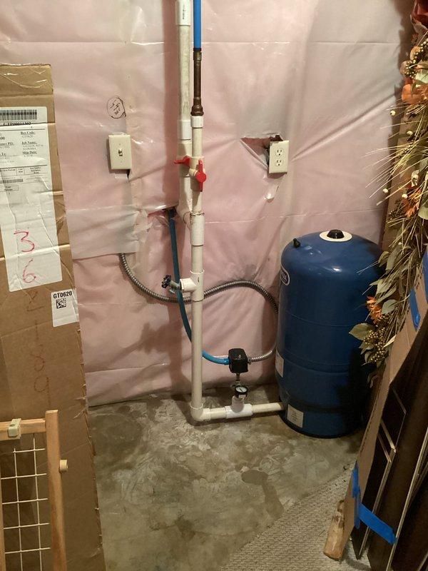 Successfully removed chemical feed pump from irrigation system by cutting 1-1/4" line at fitting below check valve and at 90-degree elbow below boiler drain tee. Spliced in new pipe sections with couplings, allowed PVC cement to cure properly, then pressurized system and verified leak-free operation. Removed pump system from premises per customer instruction. All plumbing connections tested and confirmed operational with no leaks detected.