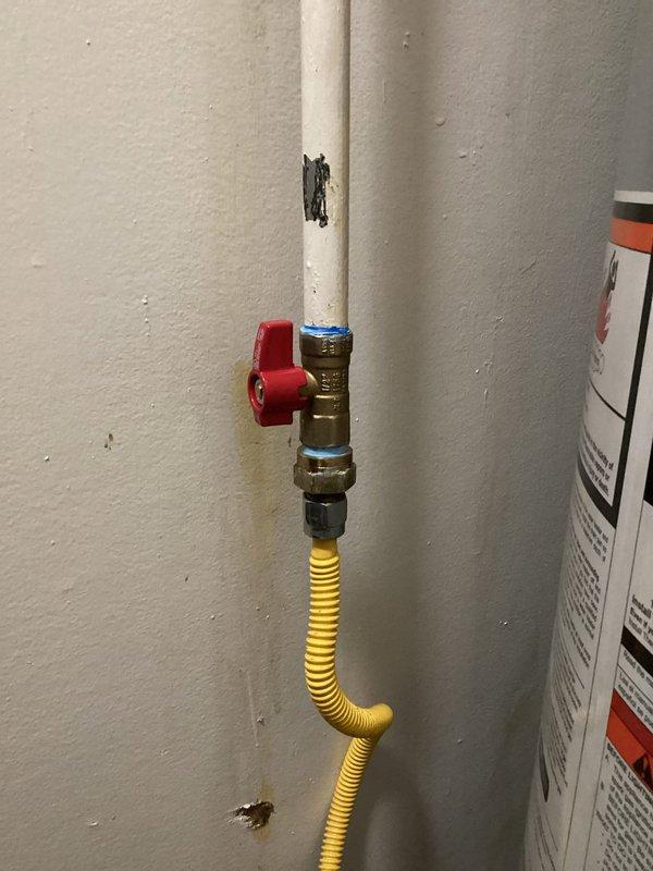 Responded to no hot water complaint at residential property. Upon arrival, inspected Whirlpool tanked water heater installation in utility room. Assessed unit condition, verified all plumbing connections including water supply lines, gas line with flexible connector, and PVC vent piping. Checked gas shut-off valve operation and examined control panel settings. Tagged unit for service and documented existing installation configuration including all safety components and manufacturer specifications for future reference.