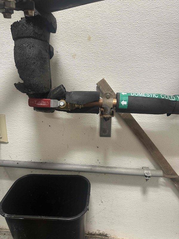 Responded to water leak at commercial property and met contact on-site to assess plumbing issue. Upon inspection, identified a leaking ball valve on the copper pipe assembly with deteriorated foam insulation. A male adapter required for the repair was ordered from Ferguson with delivery scheduled for 8/12. Once the part arrived, replaced the defective ball valve per approved quote, restoring proper function to the domestic cold water line and eliminating the leak.