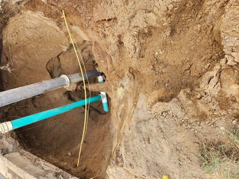 Obtained permit for sewer and water hookup from municipal utilities engineering office and coordinated excavation work for new sewer line installation. Utility locate ticket was processed prior to excavation, and worked alongside excavation contractor to complete underground sewer pipe installation in prepared trench with proper PVC piping connections.