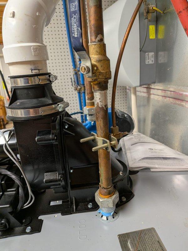 Responded to water leak emergency and completed water heater replacement in residential utility room. Protected hardwood flooring throughout work area with multiple tarps to prevent water damage during installation. Removed existing failed water heater and installed new residential tank-type water heater per previously approved specifications. Connected unit to existing copper supply lines and PEX distribution piping. Integrated installation with existing water treatment system including black filtration unit and expansion tank. Secured all pipe connections with appropriate fittings and clamps, tested system for proper operation and verified no leaks at connection points. Cleaned work area and removed old equipment and debris upon completion.
