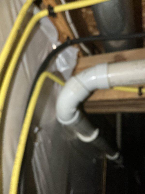 Replaced existing gas line with compliant installation featuring counterstrike protection to meet inspector requirements. Materials were procured and new gas piping was installed with proper manifold connections and securing methods, documented with photos showing the completed installation with yellow gas lines, black manifold assembly with brass fittings, and proper wall mounting.