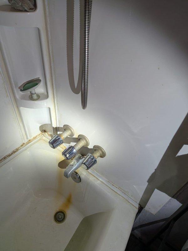 Responded to service call for 7-year-old Culligan water softener not consuming salt properly, indicating system malfunction. Performed comprehensive inspection of water treatment system in basement mechanical room, examining twin water softener tanks with blue control valves and associated plumbing connections. Assessed unit operation, control valve functionality, salt bridge formation, and brine tank operation to diagnose cause of improper regeneration cycle.