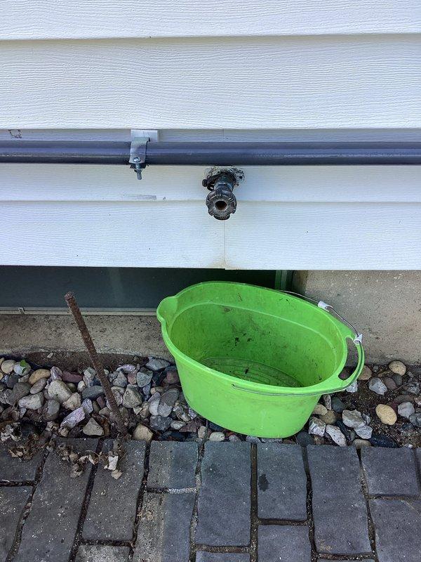 Replaced leaking rear outdoor hose bib with new frost-free sillcock and installed interior shutoff valve on copper supply line in basement. Removed old corroded spigot from exterior wall, prepared mounting surface, and secured new unit with proper pitch for drainage. Inside the structure, cut into existing copper water line, installed compression shutoff valve with brass fittings to allow seasonal isolation of exterior fixture, and pressure tested all connections to verify leak-free operation.