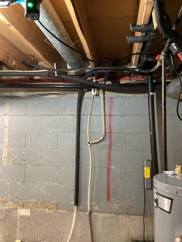 Completed gas line installation in basement utility area per quoted specifications. Picked up necessary fittings and ran new black iron gas piping along ceiling joists, properly secured to existing structure with appropriate mounting hardware. All connections made to code with proper routing through unfinished basement space, terminating at designated appliance locations including water heater area.