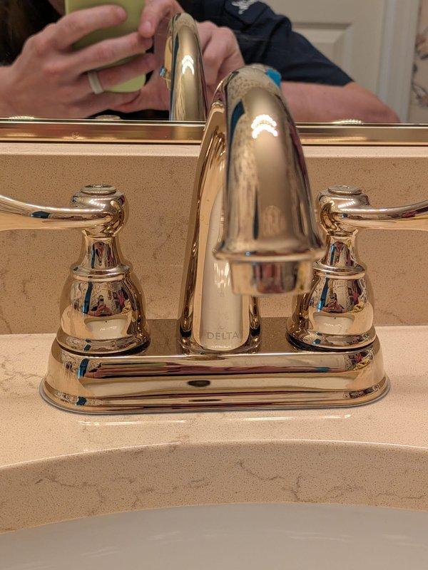 Responded to service call for three leaking faucets in the residence. Inspected and serviced two Delta brand faucets—one two-handle chrome faucet on beige countertop with integrated basin in bathroom, and one two-handle chrome faucet on white sink. Diagnosed worn internal components causing leaks, replaced cartridges and seals on all three faucet assemblies, and tested for proper operation and complete leak elimination.