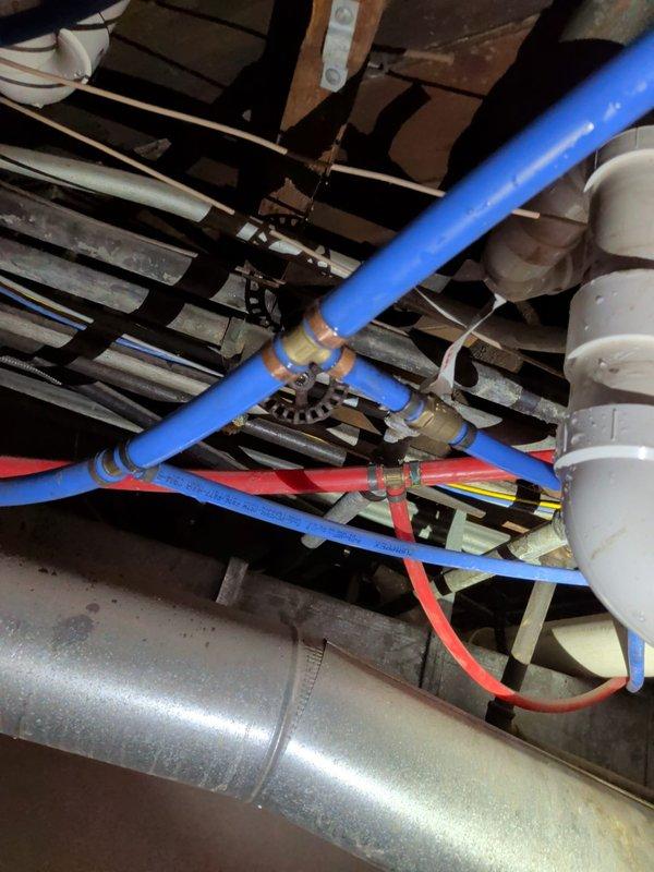 Responded to water leak in crawl space plumbing system. Located failed brass fitting connection on PEX water supply line. Replaced defective fitting with new brass compression fitting, ensuring proper seal and secure connection. Tested system for leaks and verified proper water flow through hot and cold supply lines.