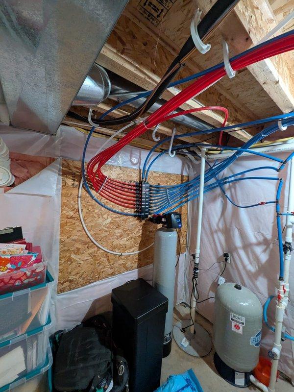 Completed water softener replacement per approved quote in basement utility area. Performed preventive maintenance tune-up on furnace system, including filter inspection and operational testing. Installed equipment connects to existing PEX manifold distribution system serving radiant heating zones. All components secured to structural supports with proper clearances maintained for code compliance and future serviceability. System tested and operational upon completion.