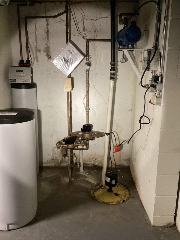 Completed toilet rebuild in commercial restroom facility. Removed existing tank components and installed new fill valve, flush valve assembly with red float mechanism, and flapper. Replaced corroded water supply shut-off valve with new fixture. Reset toilet with new wax ring seal to ensure proper connection to waste line. Tank interior showed significant age-related deterioration including rust staining and mineral deposits, which were addressed during component replacement. All internal mechanisms tested and verified operational upon completion.