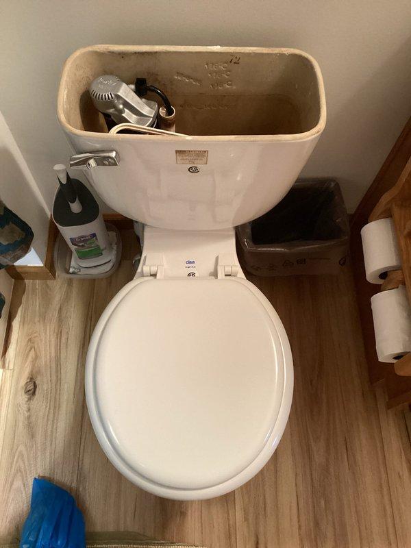 Responded to service call for slow-flushing toilet in secondary restroom. Performed diagnostic inspection of toilet tank components, including flush valve assembly, fill valve, and float mechanism. Assessed internal flushing system operation and identified potential issues affecting flush performance.