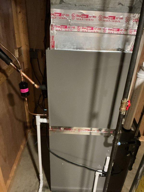 # HVAC Complete System Installation

Successfully installed a complete Lennox HVAC system including new air handler unit positioned in basement utility area between wall studs. Ran copper refrigerant lines with proper insulation, installed PVC condensate drain piping, and completed all necessary connections. Recovered existing R-22 refrigerant using recovery equipment prior to system removal. Applied manufacturer sealing tape to new air handler cabinet, verified all line sets were properly secured, and ensured proper clearances for service access. System installation completed with all components operational and ready for service.