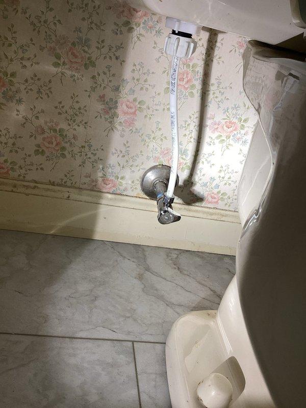 Completed pressure test on central heating system as follow-up to previous service work. Accessed property using company keys with customer authorization. Inspected plumbing fixtures including basement main valve and toilet supply lines. No active leaks detected during visual inspection. Documented existing conditions including mineral deposits and rust staining observed in toilet tank components. System holding pressure satisfactorily with no new issues identified following recent water service restoration by municipality.
