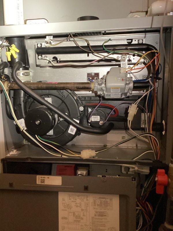 Completed planned maintenance on 26-year-old furnace system with no reported issues or operational concerns. Performed comprehensive inspection of internal components including blower motor, gas valve assembly, electrical connections, and wiring harnesses; all components found to be properly secured and functioning within normal parameters. Verified system integrity, documented equipment condition through photographic records, and confirmed unit remains operational for continued service.
