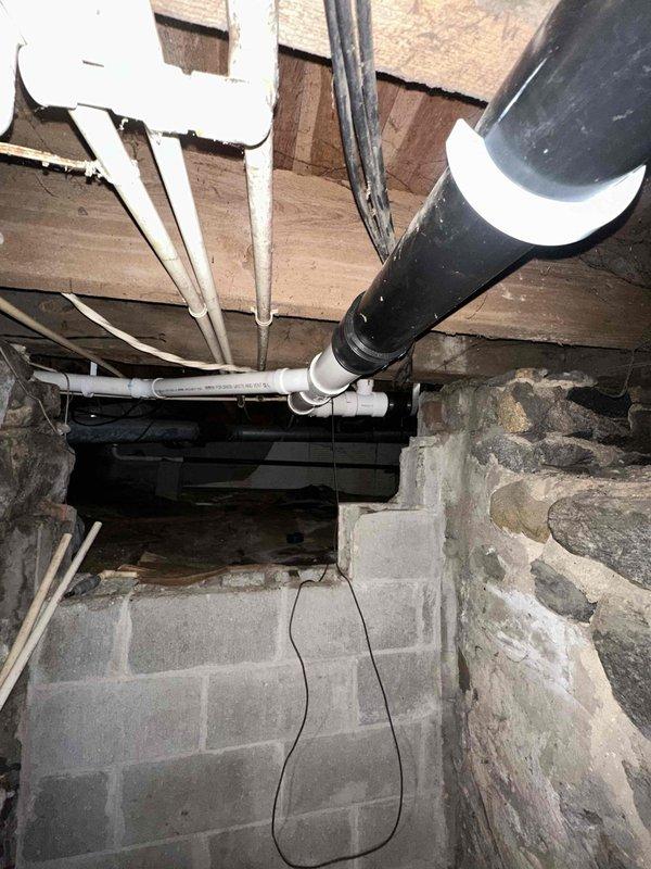 Replaced a damaged section of 3-inch main drain line in the crawl space beneath the structure. The repair involved cutting out the compromised section and installing new PVC piping with proper fittings and rubber couplings to ensure watertight connections. All work was completed to code specifications, restoring proper drainage function to the system.