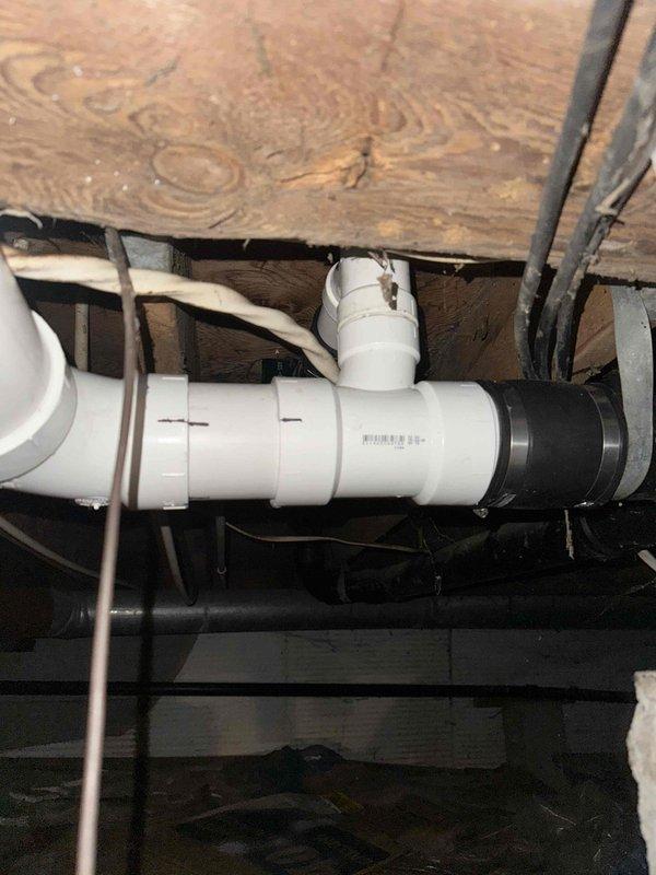 Replaced a damaged section of 3-inch main drain line in the crawl space beneath the structure. The repair involved cutting out the compromised section and installing new PVC piping with proper fittings and rubber couplings to ensure watertight connections. All work was completed to code specifications, restoring proper drainage function to the system.