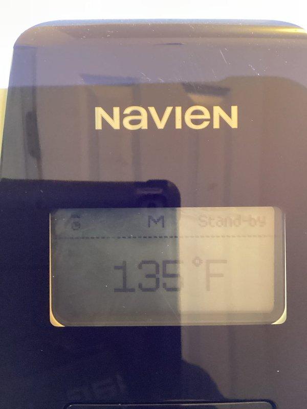 Installed surge protector on dedicated electrical circuit for Navien tankless water heater system operating at 135°F. Verified proper electrical connections to outlet serving the unit and ensured all plumbing connections, including brass shut-off valves, PEX lines, and pressure relief components, remained secure and operational following the electrical upgrade.