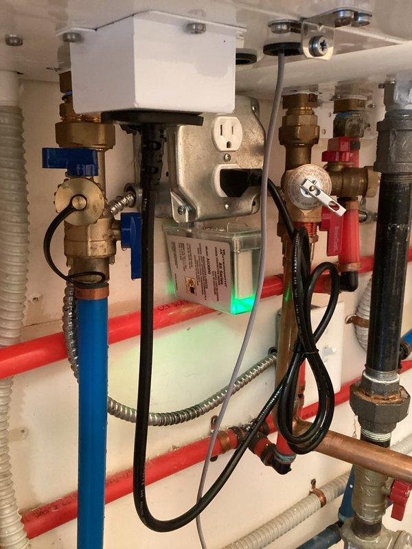 Installed surge protector on dedicated electrical circuit for Navien tankless water heater system operating at 135°F. Verified proper electrical connections to outlet serving the unit and ensured all plumbing connections, including brass shut-off valves, PEX lines, and pressure relief components, remained secure and operational following the electrical upgrade.