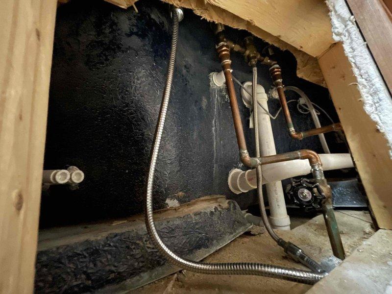 Responded to service call for bathtub faucet continuously running water overnight despite knobs being turned off. Upon arrival, diagnosed faulty cartridge assembly in tub faucet causing failure to shut off water flow completely. Accessed plumbing through wall cavity behind fixture, shut off water supply at copper pipe shut-off valves, and removed defective cartridge. Installed replacement cartridge assembly, reconnected supply lines, and restored water service. Tested faucet operation through multiple on/off cycles to verify proper shut-off function and confirmed no leaks present. Restored wall access panel and left fixture fully operational.