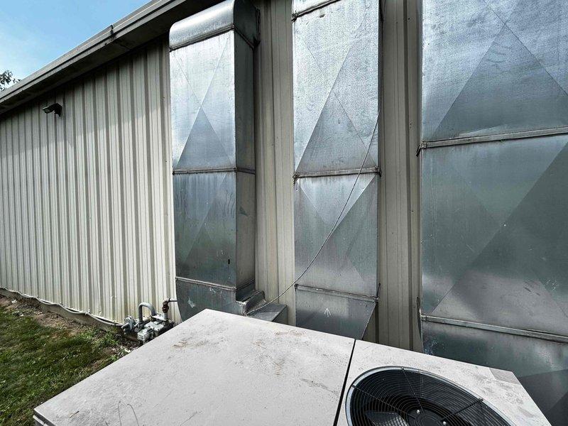 Responded to commercial property for HVAC system blowing warm air. Evaluated three packaged rooftop units and determined Unit #1 requires complete replacement due to system failure and age-related deterioration. Unit exhibited compromised heat exchanger with significant discoloration and reduced efficiency, unable to maintain proper cooling. Provided estimate for replacement of failed unit and additional quotes for Units #2 and #3 to allow for preventative replacement planning, as all three units are approximately 10 years old and approaching end of service life. Documented equipment condition with photos showing exterior cabinet weathering and coil degradation. Recommended full system replacement to restore reliable climate control to the facility.