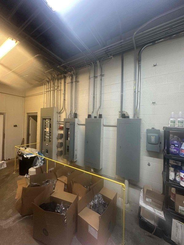 Completed on-site evaluation of existing commercial gas-fired tank-type water heater installation in mechanical room. Assessed A.O. Smith water heater unit, including examination of gas supply connections, venting configuration, and surrounding plumbing infrastructure. Documented existing copper piping network, metallic ductwork, and ventilation systems connected to the unit. Photographed water heater controls, valves, manufacturer specifications, and overall installation layout including electrical panels and utility connections to provide comprehensive estimate for replacement or service requirements.