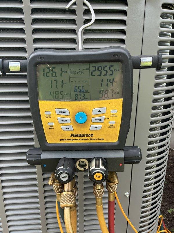 Completed full HVAC system installation including furnace, air conditioning unit, thermostat, and humidifier. The outdoor condensing unit was professionally positioned on a concrete pad with proper clearances and landscaping considerations. System was charged with refrigerant and commissioning tests were performed using calibrated manifold gauges, verifying proper operating pressures and temperatures across the system. All equipment is functioning within manufacturer specifications and ready for operation.