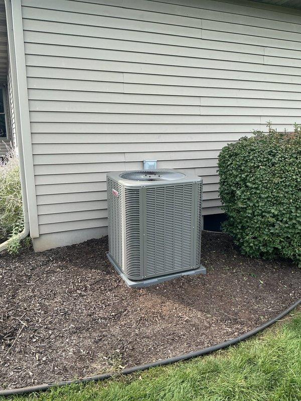 Completed full HVAC system installation including furnace, air conditioning unit, thermostat, and humidifier. The outdoor condensing unit was professionally positioned on a concrete pad with proper clearances and landscaping considerations. System was charged with refrigerant and commissioning tests were performed using calibrated manifold gauges, verifying proper operating pressures and temperatures across the system. All equipment is functioning within manufacturer specifications and ready for operation.