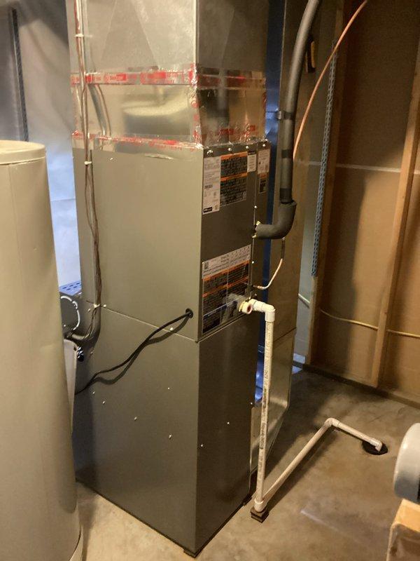 Completed full HVAC system installation in residential basement utility area, including new furnace unit with associated ductwork connections and gas line integration. Reused existing thermostat and air filter to minimize customer costs while ensuring proper system functionality. Collected final payment balance upon successful completion and system verification.