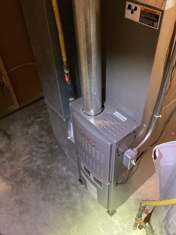 Completed full HVAC system installation in residential basement utility area, including new furnace unit with associated ductwork connections and gas line integration. Reused existing thermostat and air filter to minimize customer costs while ensuring proper system functionality. Collected final payment balance upon successful completion and system verification.