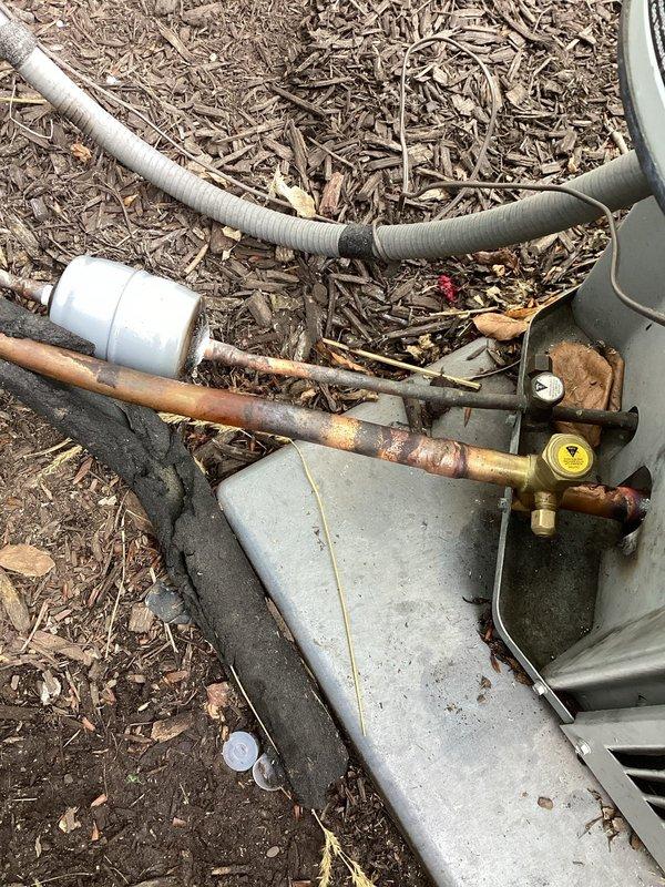 Responded to service callback for AC system repairs. Reclaimed refrigerant from system, replaced failed suction side service port and liquid line dryer. Performed pressure test to verify system integrity with no leaks detected. Evacuated system to below 500 microns and recharged with proper amount of R410A refrigerant. Completed startup procedures and performed all necessary checks and adjustments to ensure proper system operation. Unit tested and left operating within manufacturer specifications.